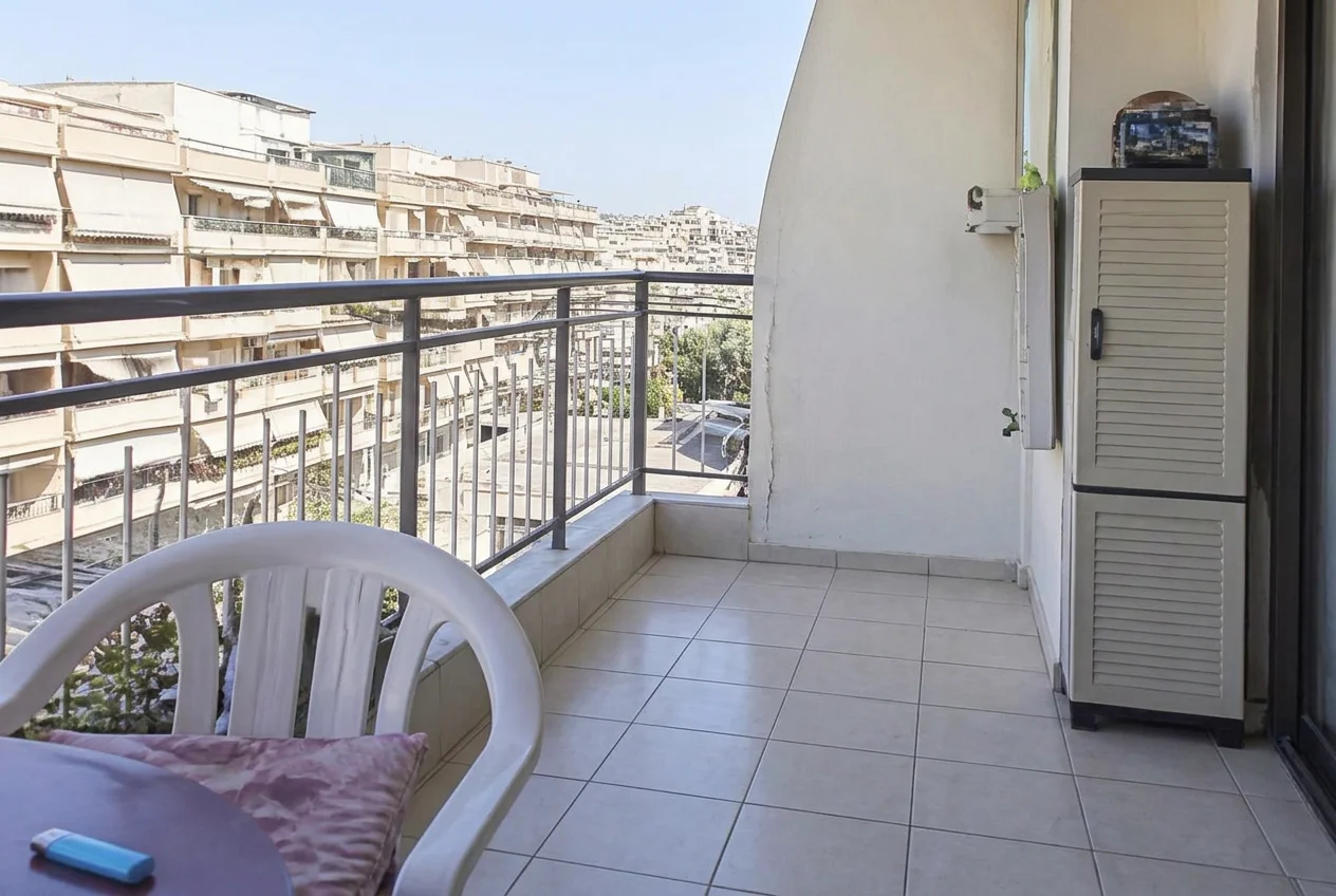 Clear balcony after AI Virtual Decluttering removed storage boxes and the drying rack