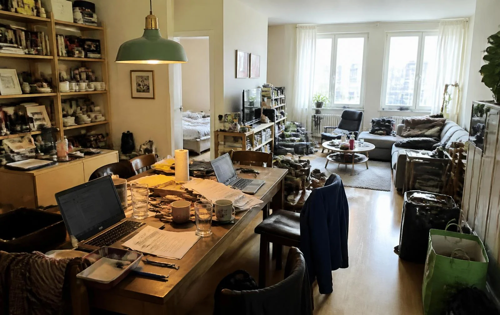 Cluttered open-plan dining and living area before AI virtual decluttering